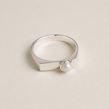Slim silver signet ring with button pearl cabochon